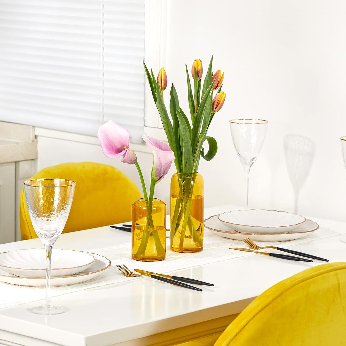 Premium Photo  Orange drink served in a crystal glass with a slice and a  vase on the table